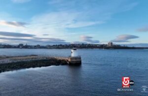Screen shot of an aerial photograph of Bug Light and Casco Bay with Portland, Maine in the background.